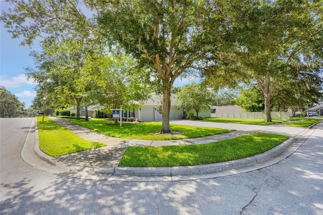2782 Cedar Knoll Dr, Apopka, FL 32712 - obstructed view of property with a front lawn, driveway, and a garage