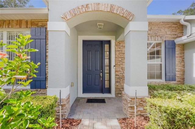 2782 Cedar Knoll Dr, Apopka, FL 32712 - doorway to property with stone siding and stucco siding