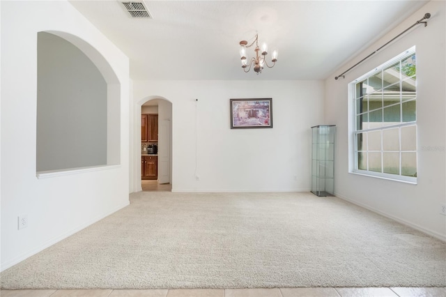 2782 Cedar Knoll Dr, Apopka, FL 32712 - spare room with carpet, a chandelier, and arched walkways
