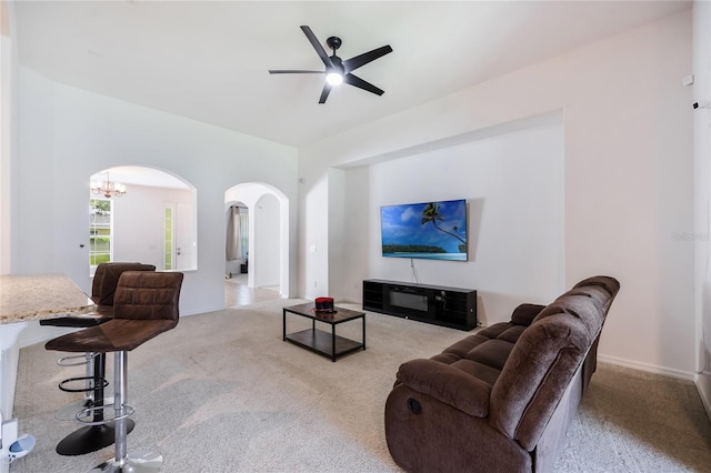 2782 Cedar Knoll Dr, Apopka, FL 32712 - living area featuring arched walkways, carpet flooring, a ceiling fan, and a chandelier