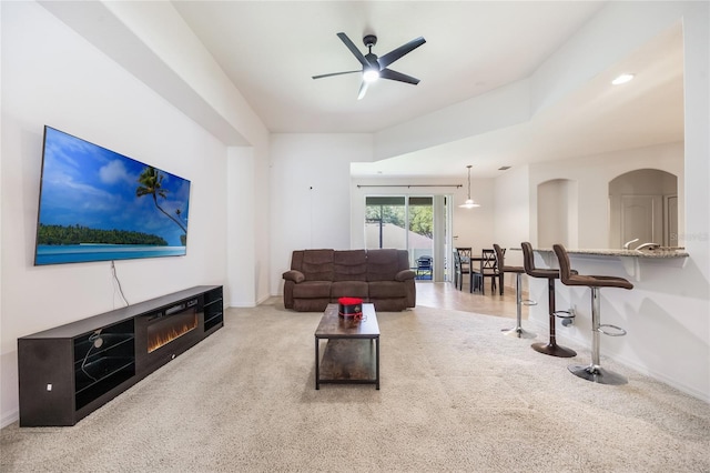 2782 Cedar Knoll Dr, Apopka, FL 32712 - living room with ceiling fan, carpet floors, and arched walkways
