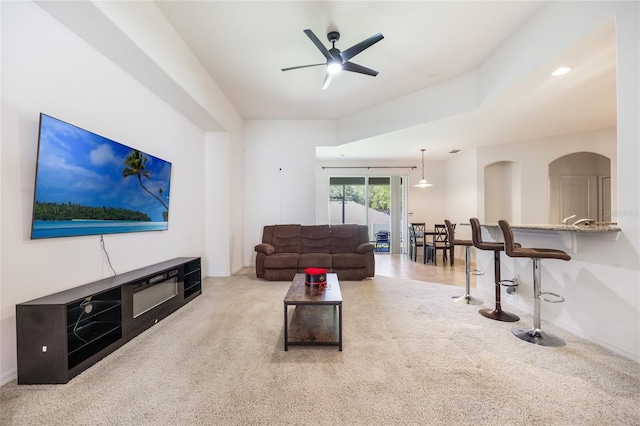 2782 Cedar Knoll Dr, Apopka, FL 32712 - living room with carpet, a ceiling fan, and arched walkways