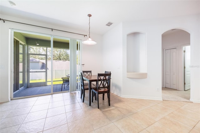 2782 Cedar Knoll Dr, Apopka, FL 32712 - dining space featuring light tile patterned floors and arched walkways