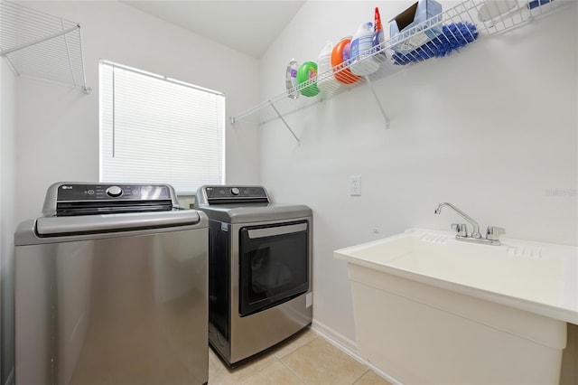 2782 Cedar Knoll Dr, Apopka, FL 32712 - laundry room with independent washer and dryer and light tile patterned floors