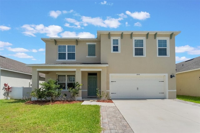6808 Cranes Roost Rd, Harmony, FL 34773 - view of front of property with stucco siding, concrete driveway, a garage, and covered porch