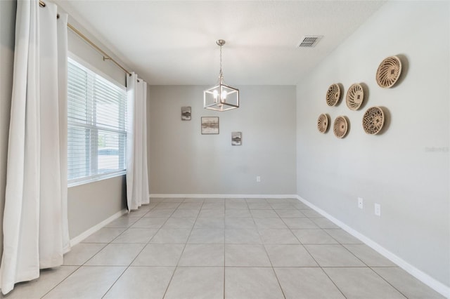 6808 Cranes Roost Rd, Harmony, FL 34773 - unfurnished dining area with light tile patterned flooring and baseboards