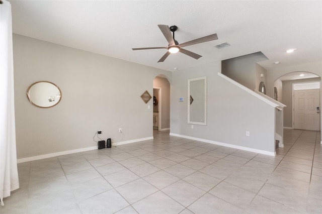 6808 Cranes Roost Rd, Harmony, FL 34773 - empty room featuring arched walkways, ceiling fan, light tile patterned floors, and recessed lighting
