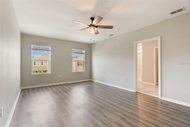 6808 Cranes Roost Rd, Harmony, FL 34773 - unfurnished room featuring wood finished floors and a ceiling fan