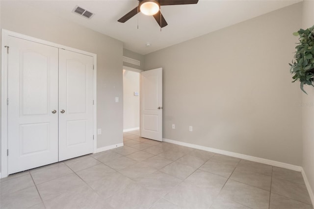 6808 Cranes Roost Rd, Harmony, FL 34773 - unfurnished bedroom featuring light tile patterned floors, a closet, and ceiling fan