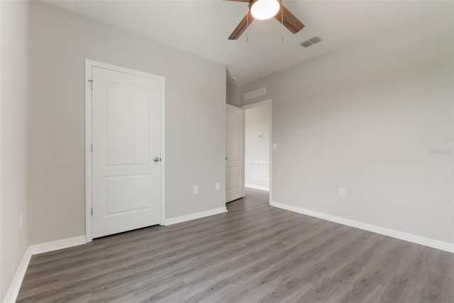 6808 Cranes Roost Rd, Harmony, FL 34773 - unfurnished bedroom with wood finished floors and a ceiling fan