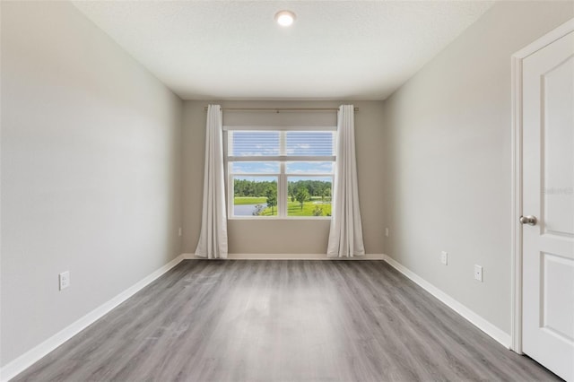 6808 Cranes Roost Rd, Harmony, FL 34773 - unfurnished room with wood finished floors and baseboards