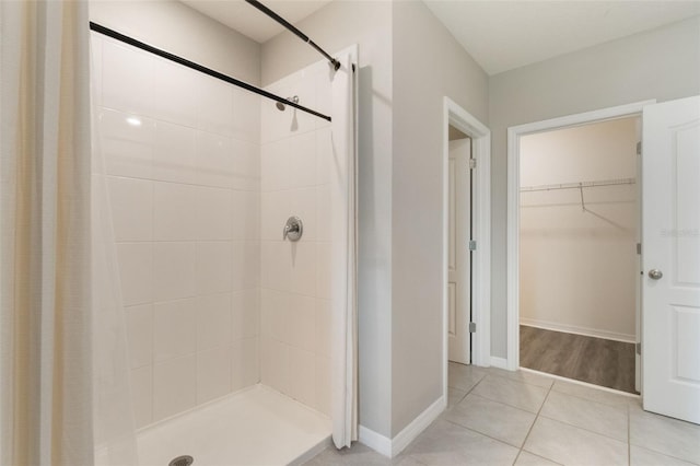 6808 Cranes Roost Rd, Harmony, FL 34773 - full bathroom with a shower stall, tile patterned floors, and a spacious closet