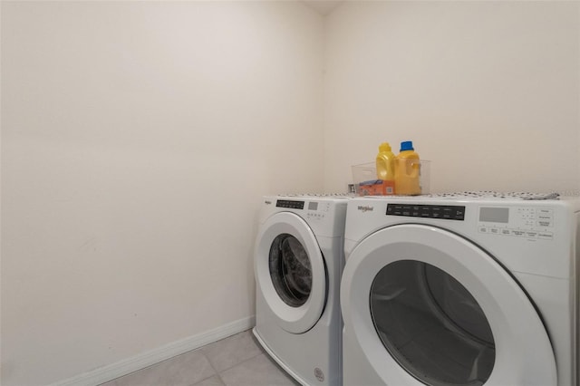 6808 Cranes Roost Rd, Harmony, FL 34773 - laundry area with washing machine and dryer and light tile patterned floors