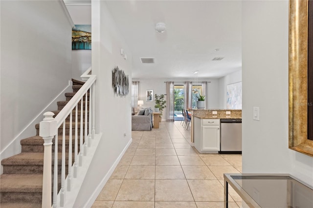 9023 Shadow Mountain St, Davenport, FL 33896 - kitchen featuring dishwasher, light tile patterned floors, white cabinets, open floor plan, and light stone countertops