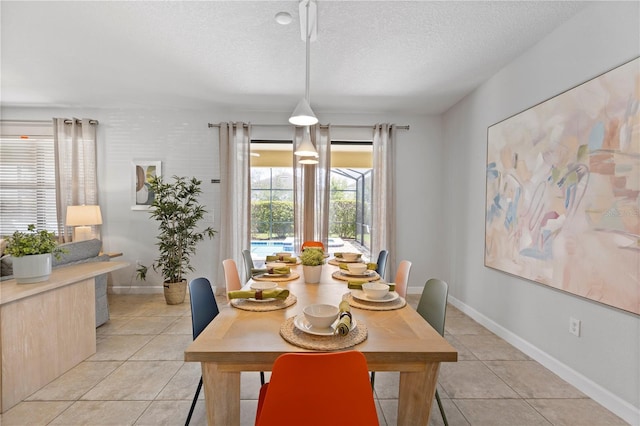 9023 Shadow Mountain St, Davenport, FL 33896 - dining space featuring a textured ceiling and light tile patterned floors