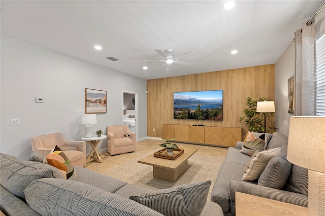 9023 Shadow Mountain St, Davenport, FL 33896 - living area featuring wood walls, recessed lighting, a ceiling fan, and an accent wall