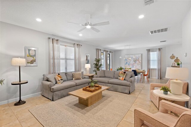 9023 Shadow Mountain St, Davenport, FL 33896 - living area with a ceiling fan, light tile patterned floors, and recessed lighting