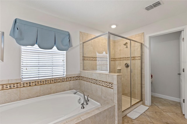 9023 Shadow Mountain St, Davenport, FL 33896 - bathroom with a garden tub, a stall shower, and tile patterned floors