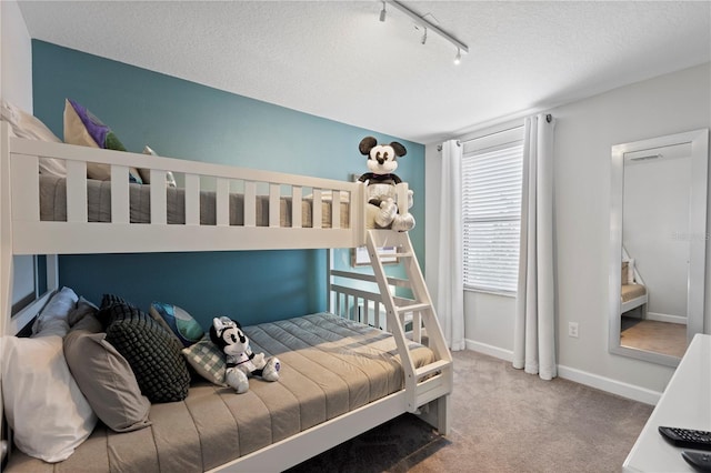 9023 Shadow Mountain St, Davenport, FL 33896 - bedroom featuring track lighting, carpet floors, and a textured ceiling
