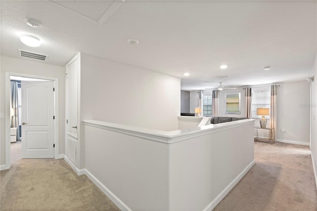 9023 Shadow Mountain St, Davenport, FL 33896 - corridor with light carpet, an upstairs landing, and recessed lighting