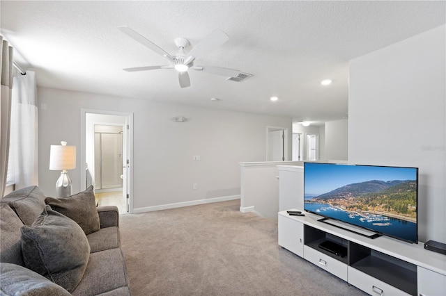 9023 Shadow Mountain St, Davenport, FL 33896 - living area featuring light colored carpet, ceiling fan, recessed lighting, and a textured ceiling