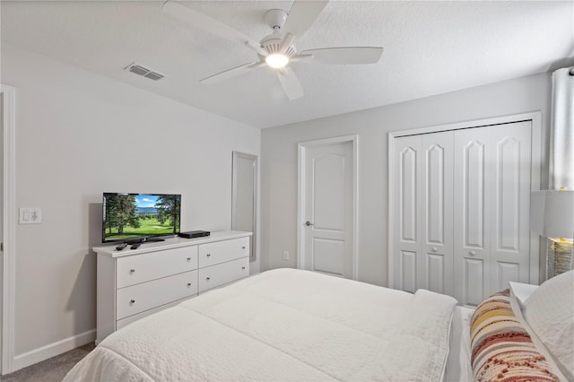 9023 Shadow Mountain St, Davenport, FL 33896 - bedroom with carpet floors, a closet, and ceiling fan