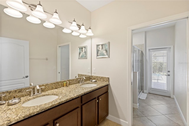 9023 Shadow Mountain St, Davenport, FL 33896 - bathroom with tile patterned flooring, double vanity, and a stall shower