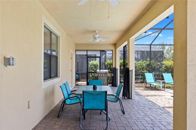 9023 Shadow Mountain St, Davenport, FL 33896 - view of patio featuring a ceiling fan, glass enclosure, outdoor dining area, and area for grilling