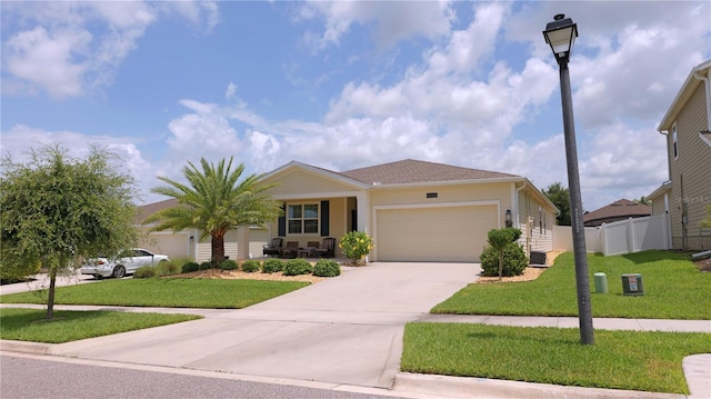 4858 Magnetite Loop, Mount Dora, FL 32757 - ranch-style home with a garage, covered porch, and concrete driveway