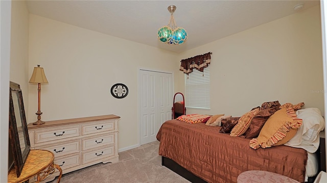 4858 Magnetite Loop, Mount Dora, FL 32757 - bedroom featuring light carpet, a closet, and a chandelier
