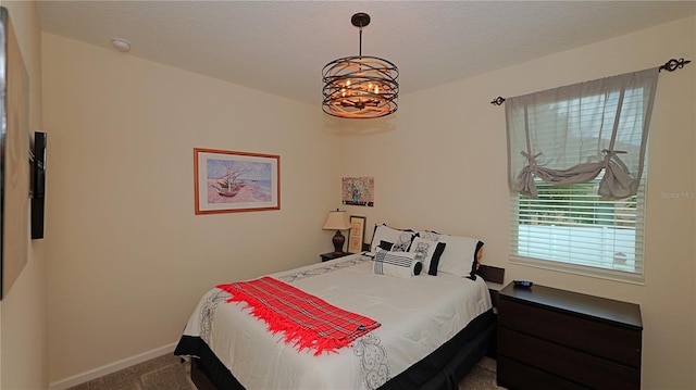 4858 Magnetite Loop, Mount Dora, FL 32757 - bedroom with carpet floors, a chandelier, and a textured ceiling