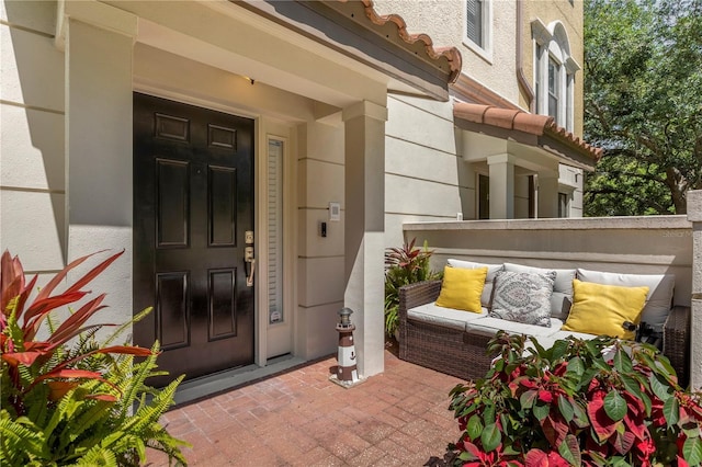 3508 Porta Romano Way, Lake Mary, FL 32746 - doorway to property featuring an outdoor living space and stucco siding