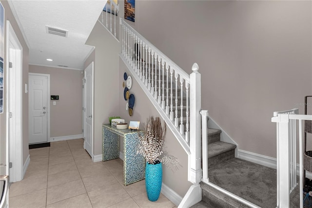 3508 Porta Romano Way, Lake Mary, FL 32746 - staircase with tile patterned floors and a textured ceiling