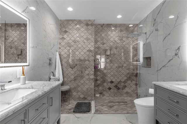 3508 Porta Romano Way, Lake Mary, FL 32746 - bathroom with vanity, tile walls, marble finish floors, a tile shower, and recessed lighting