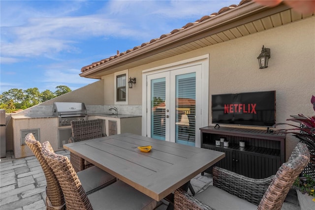 3508 Porta Romano Way, Lake Mary, FL 32746 - view of patio / terrace with exterior kitchen, french doors, and outdoor dining space