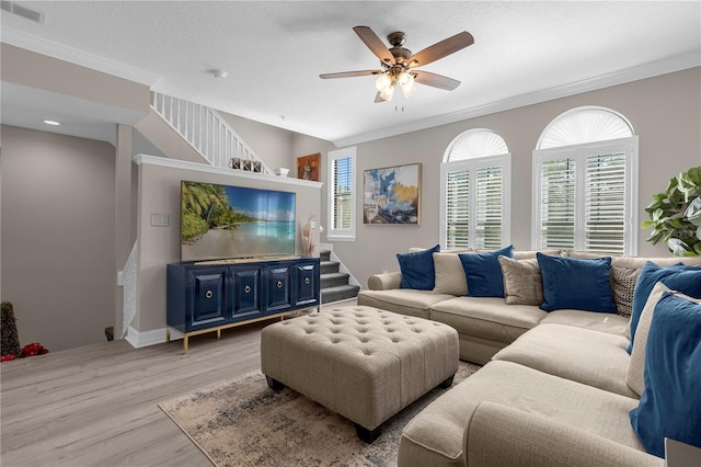 3508 Porta Romano Way, Lake Mary, FL 32746 - living room with stairway, light wood-style flooring, crown molding, and ceiling fan