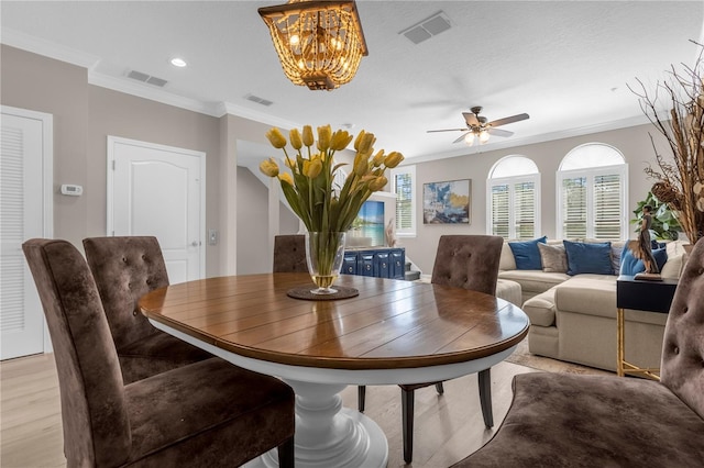 3508 Porta Romano Way, Lake Mary, FL 32746 - dining room featuring crown molding, a chandelier, a ceiling fan, recessed lighting, and light wood finished floors