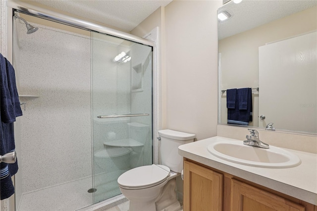 17097 SE 96th Chapelwood Cir, The Villages, FL 32162 - bathroom featuring a stall shower, vanity, and a textured ceiling