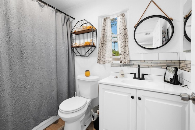 5141 Mallet Dr, Port Richey, FL 34668 - bathroom with vanity, wood finished floors, crown molding, and tasteful backsplash