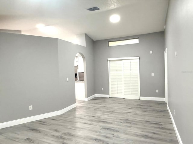 926 Freshmeadow Ct, Apopka, FL 32703 - unfurnished room with arched walkways and wood finished floors