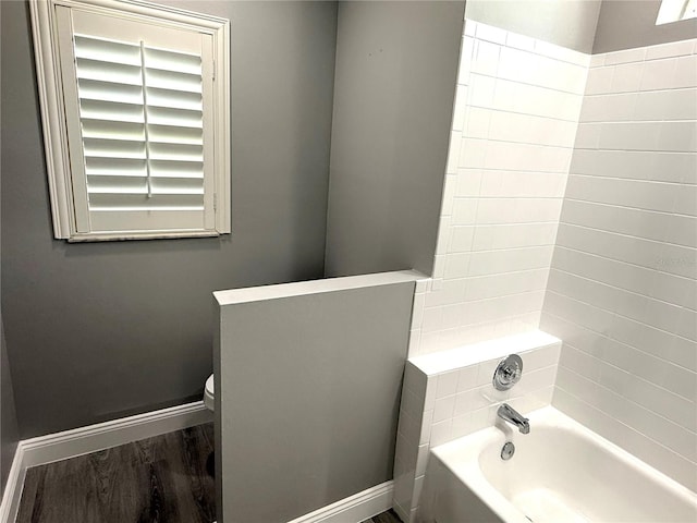 926 Freshmeadow Ct, Apopka, FL 32703 - bathroom with  shower combination and wood finished floors