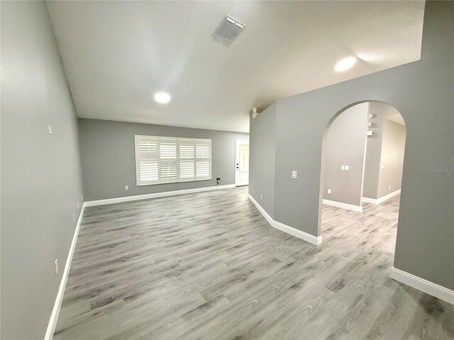 926 Freshmeadow Ct, Apopka, FL 32703 - spare room featuring arched walkways and light wood-style floors