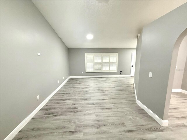 926 Freshmeadow Ct, Apopka, FL 32703 - unfurnished room featuring arched walkways, wood finished floors, and recessed lighting