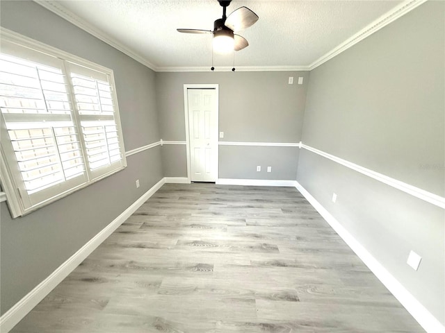926 Freshmeadow Ct, Apopka, FL 32703 - unfurnished room with ceiling fan, a textured ceiling, wood finished floors, and ornamental molding