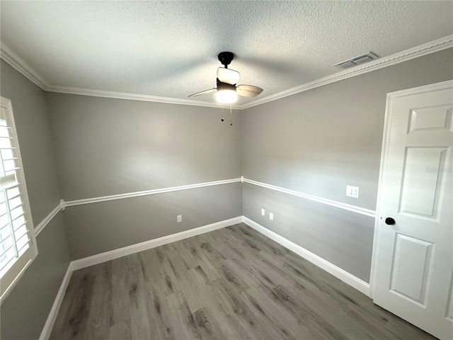 926 Freshmeadow Ct, Apopka, FL 32703 - spare room with ceiling fan, wood finished floors, a textured ceiling, and crown molding