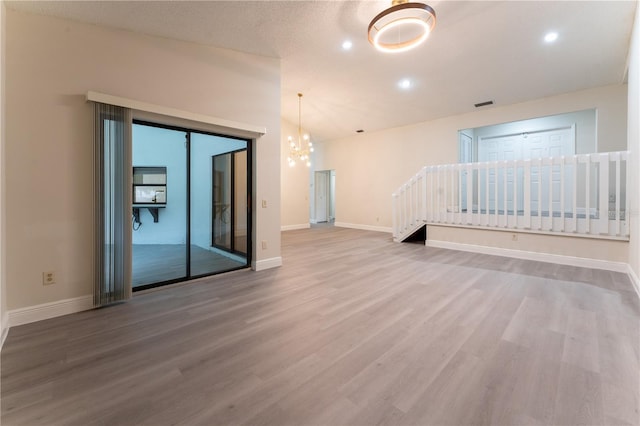 6019 Crystal View Dr, Orlando, FL 32819 - unfurnished room featuring wood finished floors, a chandelier, and recessed lighting