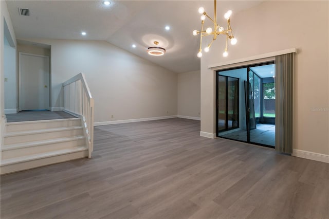 6019 Crystal View Dr, Orlando, FL 32819 - unfurnished living room featuring stairs, wood finished floors, vaulted ceiling, a chandelier, and recessed lighting