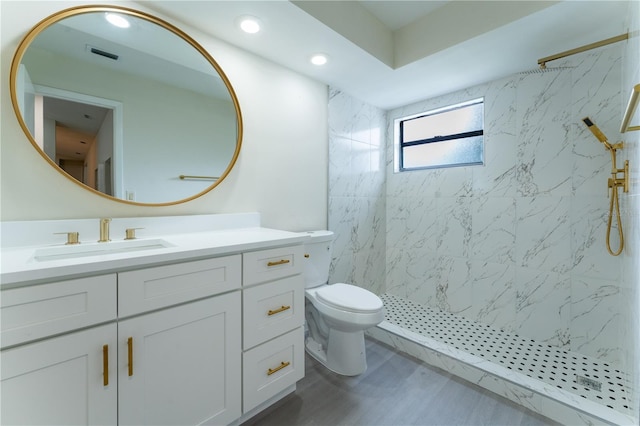 6019 Crystal View Dr, Orlando, FL 32819 - full bath with vanity, a marble finish shower, wood finished floors, and recessed lighting