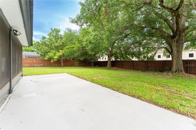 6019 Crystal View Dr, Orlando, FL 32819 - fenced backyard with a patio