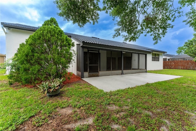 6019 Crystal View Dr, Orlando, FL 32819 - back of property with a patio area, stucco siding, and a sunroom